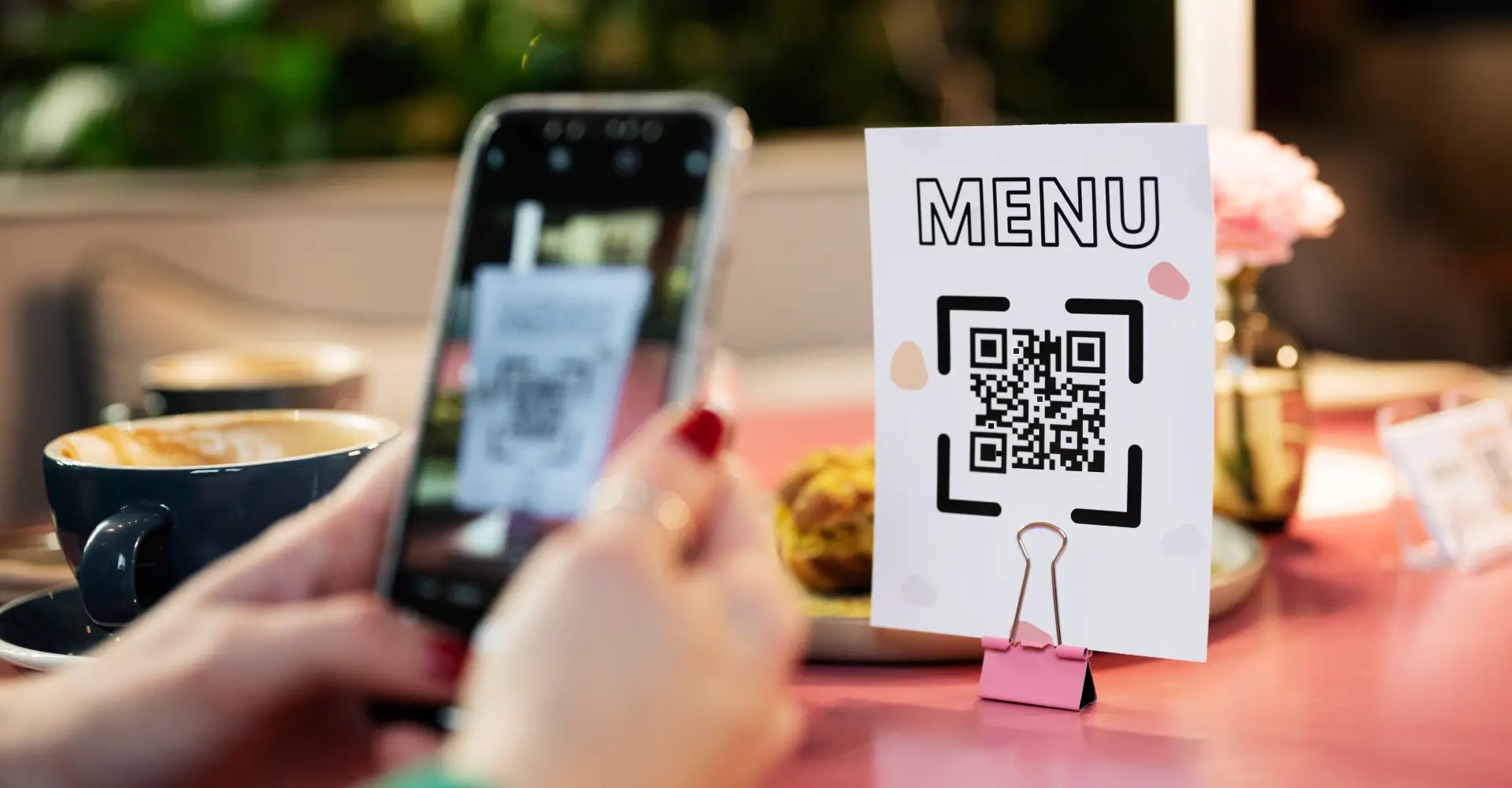 A smartphone displaying a QR code, ready to be scanned.